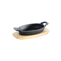 Cast iron serving pan -oval- with 2 handles Ø 21x15,5 cm and wooden coaster